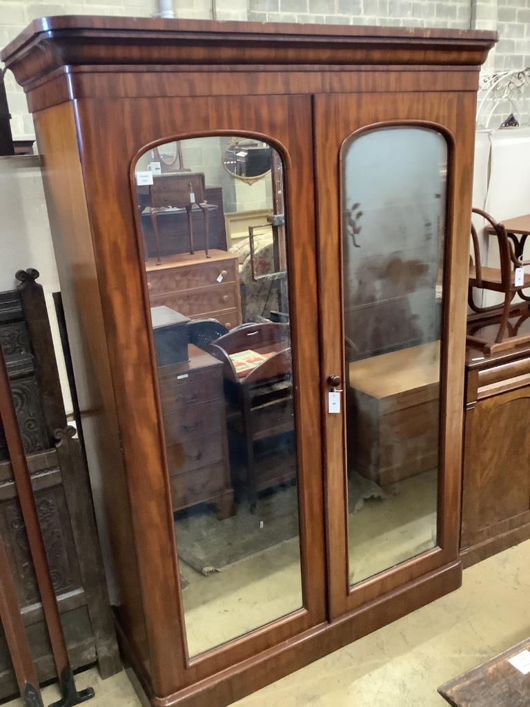 A Victorian mahogany mirrored two door wardrobe, width 142cm depth 60cm height 208cm
